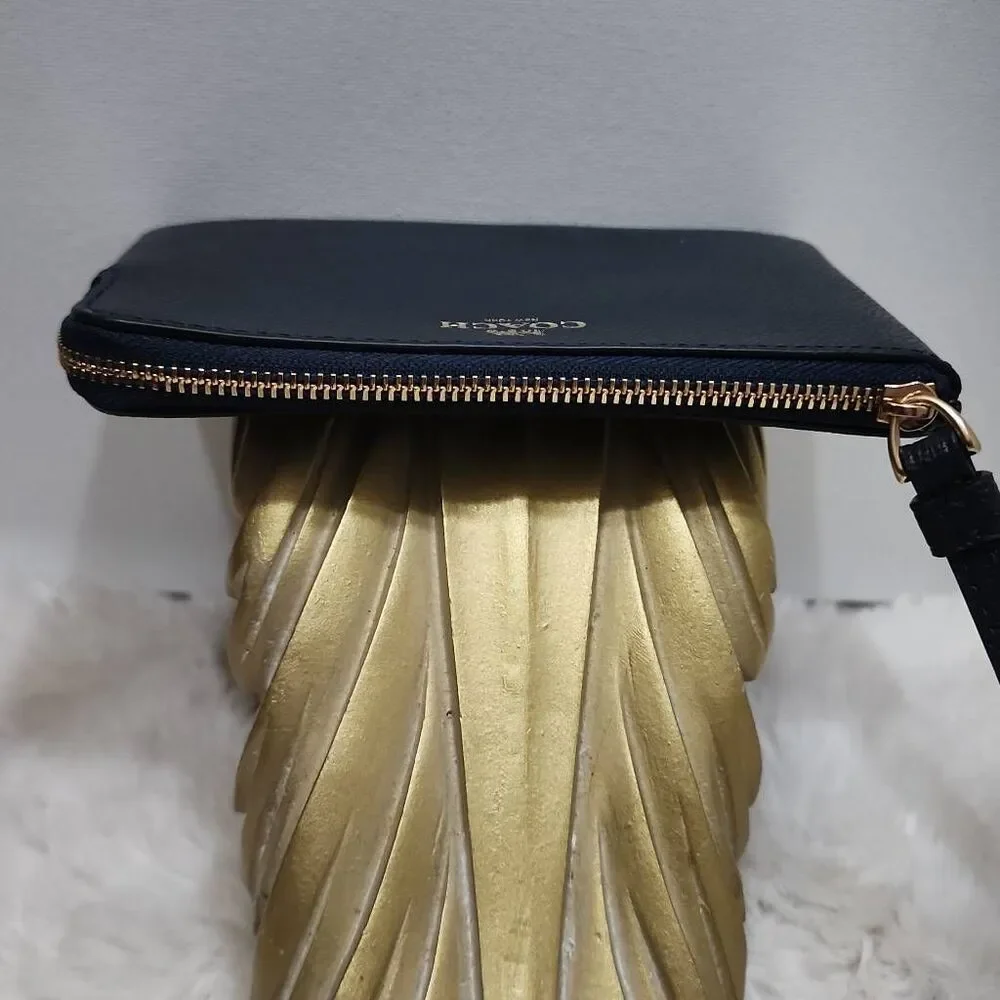 Coach Corner Zip Wristlet in crossgrain leather.